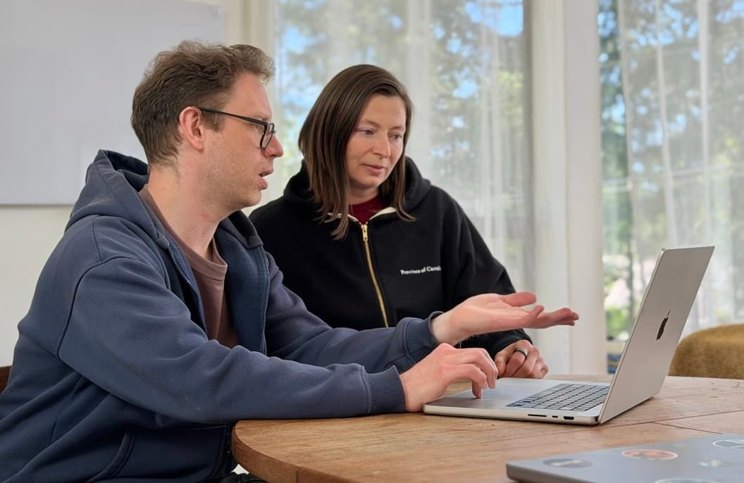 Andrew and Olena reviewing AI tool work process and productivity gains