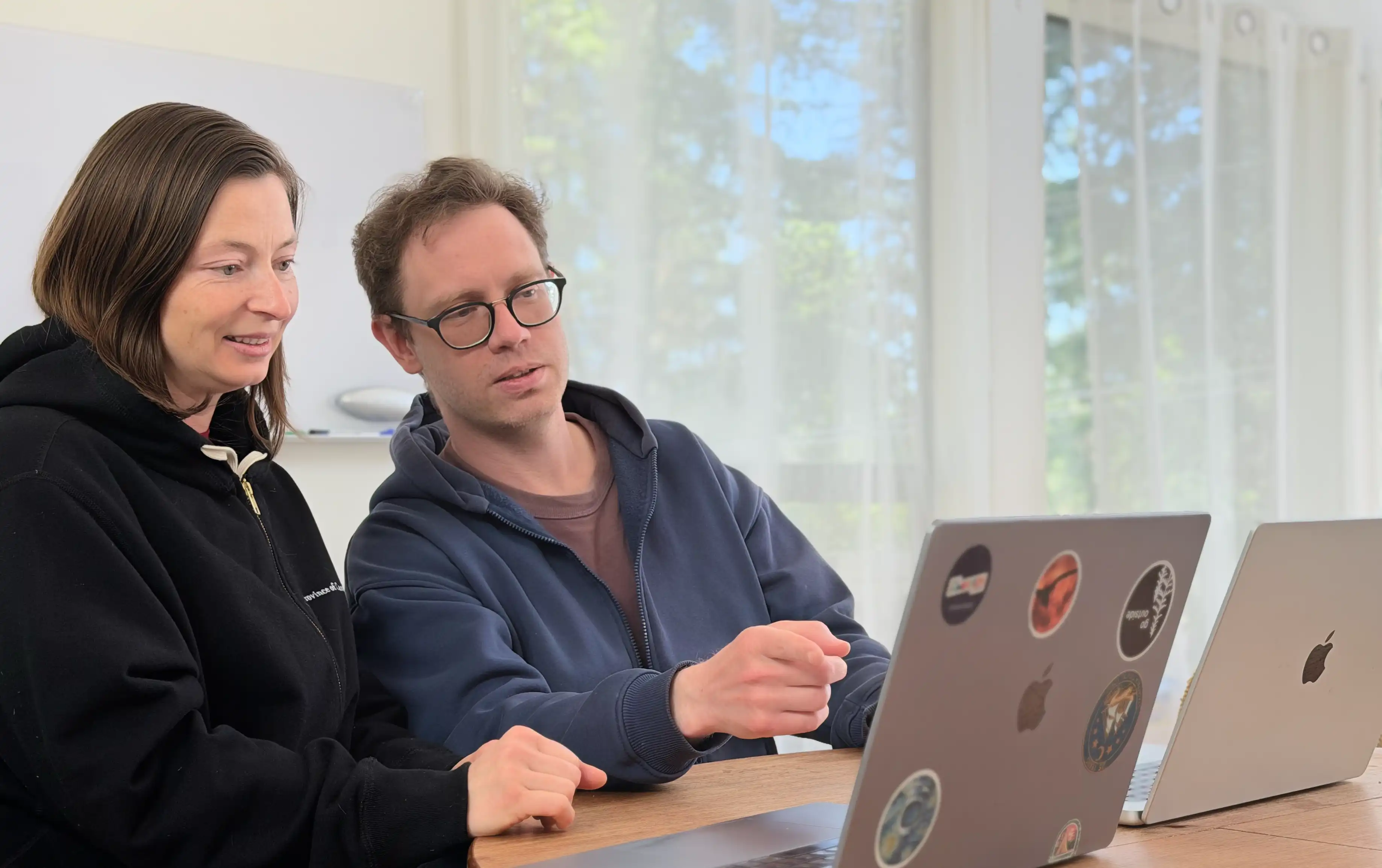 Pieoneers co-founders Olena and Andrew working through an app development workflow